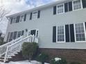 Two-story house with gray siding, brick base, and black shutters at 1485 Reynolds Sw Rd, Atlanta, GA 30331