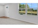 Bright living room with neutral carpeting and large windows at , Stone Mountain, GA 30087