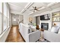 Inviting living room with coffered ceiling, fireplace, and hardwood floors, offering a cozy and stylish atmosphere at 2396 Whiteoak Se Bnd # 16, Smyrna, GA 30080