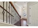 Interior view of a staircase with dark wood railing and hardwood floors at 108 Kasey Dr, Woodstock, GA 30189