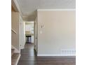 Living room with dark laminate floors and kitchen view at 2473 Tyler Way, Decatur, GA 30032