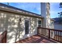 Wooden deck with access to the backyard and wooded area at 113 Omega Ct, Dallas, GA 30157