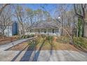 Gray house with wrap around porch and paved driveway at 3796 Hickory Ridge Ct, Marietta, GA 30066