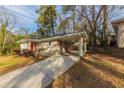 House exterior showcasing carport and driveway at 3110 Mcafee Rd, Decatur, GA 30032