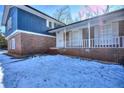 Side view of the house with snow on the ground at 4593 Bexley Way, Stone Mountain, GA 30083