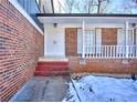 Brick front entrance with white door and steps at 4593 Bexley Way, Stone Mountain, GA 30083