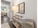 Bright entryway with light gray walls, hardwood floors, and a console table at 5571 Hislop Ln # 41, Mableton, GA 30126