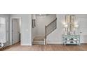 Staircase with a metal railing leading to the upper level at 1182 Chastain Dr # 8, Sugar Hill, GA 30518