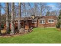 Spacious backyard featuring a wooden deck and lush lawn, perfect for outdoor enjoyment at 3660 Hickory Se Cir, Smyrna, GA 30080