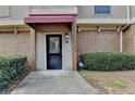 Townhome entrance with black door and red awning at 3301 Henderson Mill Rd # R1, Chamblee, GA 30341