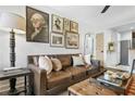 Living room with brown leather couch and gallery wall at 40 Daniel Se St # 6, Atlanta, GA 30312