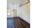 Dining room with hardwood floors and modern chandelier at 415 Dove Ln, Social Circle, GA 30025