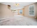 Spacious living room with neutral carpeting and large windows at 6691 Sunset Hills Blvd, Rex, GA 30273