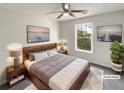 Spacious bedroom with wood bed frame and large window at 1535 Valley Club Dr, Lawrenceville, GA 30044
