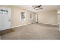 Spacious living room with neutral carpeting and large windows at 4074 Yeager Rd, Douglasville, GA 30135