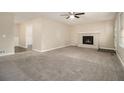 Living room with fireplace and neutral carpeting at 4074 Yeager Rd, Douglasville, GA 30135
