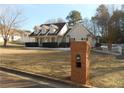 Brick mailbox in front of a beige house with a large yard at 610 Erins Way, Mcdonough, GA 30253