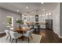 Modern kitchen with white cabinets, granite counters, and island at 1102 Fountain Sw Dr, Atlanta, GA 30314