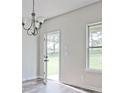 Dining room with hardwood floors and access to backyard at 11821 Rizvan Pl, Covington, GA 30014