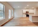 Kitchen with white cabinets, stainless steel appliances, and island at 11821 Rizvan Pl, Covington, GA 30014