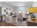 Bright and airy living room featuring hardwood floors and ample natural light at 130 26Th Nw St # 804, Atlanta, GA 30309