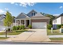 Brick and shingle ranch home with two-car garage and landscaped yard at 113 Overlook Ridge Way, Canton, GA 30114