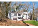 Charming two-story home with a nicely maintained lawn, painted brick, and a front porch at 2976 Bay Berry Sw Dr, Marietta, GA 30008