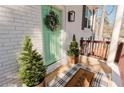 Close-up of front door and porch with decorative plants and a welcome mat at 2976 Bay Berry Sw Dr, Marietta, GA 30008