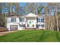Inviting brick home with attached garage and a pristine lawn, complemented by a welcoming front entrance at 2976 Bay Berry Sw Dr, Marietta, GA 30008