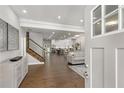 Bright and airy entryway with hardwood floors and view into the living area at 199 Racine Sw St, Atlanta, GA 30314