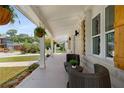 Inviting front porch with wicker seating and hanging planters at 199 Racine Sw St, Atlanta, GA 30314