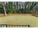 Large fenced backyard with grassy lawn, providing ample outdoor space at 2546 Glendale Se Cir, Smyrna, GA 30080