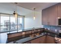 Modern kitchen with stainless steel appliances and granite countertops at 1080 Peachtree Ne St # 2716, Atlanta, GA 30309