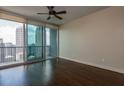 Spacious living room with hardwood floors and city views at 1080 Peachtree Ne St # 2716, Atlanta, GA 30309