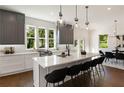 Modern kitchen with gray cabinets, white countertops, and a large island at 1432 Mims Sw St, Atlanta, GA 30314