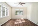 Bright living room featuring hardwood floors and large windows at 1603 Hollyhock Ter, Decatur, GA 30032