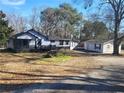 Property includes a main house, detached garage, and large yard at 2455 Lake Harbin Rd, Morrow, GA 30260