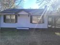 Cute ranch home with brown shutters and a small front porch at 2455 Lake Harbin Rd, Morrow, GA 30260