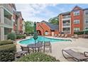 Community pool surrounded by lounge chairs, providing a perfect spot for relaxation and socializing at 3066 Chastain Park Ne Ct, Atlanta, GA 30342