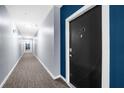 Building hallway with gray walls and carpet flooring at 800 Peachtree Ne St # 8607, Atlanta, GA 30308