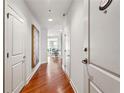 Bright hallway with hardwood floors and modern doors at 325 E Paces Ferry Ne Rd # 1608, Atlanta, GA 30305