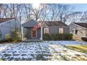 Cute gray bungalow with a covered porch and manicured lawn at 1327 Hosea L Williams Se Dr, Atlanta, GA 30317