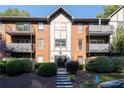 Attractive brick building with double front doors and manicured landscaping at 6851 Roswell Rd # F35, Atlanta, GA 30328