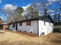 Newly renovated ranch home with white brick and updated landscaping at 4664 Ryan Rd, Conley, GA 30288