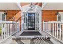 Front entrance with black door and white columns at 885 Briarcliff Ne Rd # 21, Atlanta, GA 30306