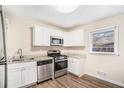 Updated kitchen, featuring stainless steel appliances and granite countertops at 226 Collum Nw St, Atlanta, GA 30314