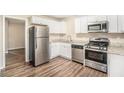 Modern kitchen with stainless steel appliances and granite countertops at 226 Collum Nw St, Atlanta, GA 30314