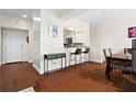 Bright dining area with hardwood floors and kitchen views at 2855 Peachtree Ne Rd # 115, Atlanta, GA 30305