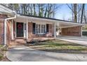 Brick stoop leading to the entrance of a ranch house at 3251 Wanda Woods Dr, Atlanta, GA 30340