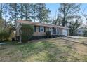 Brick ranch house with a carport and well-maintained lawn at 4163 Citizen Cir, Austell, GA 30106